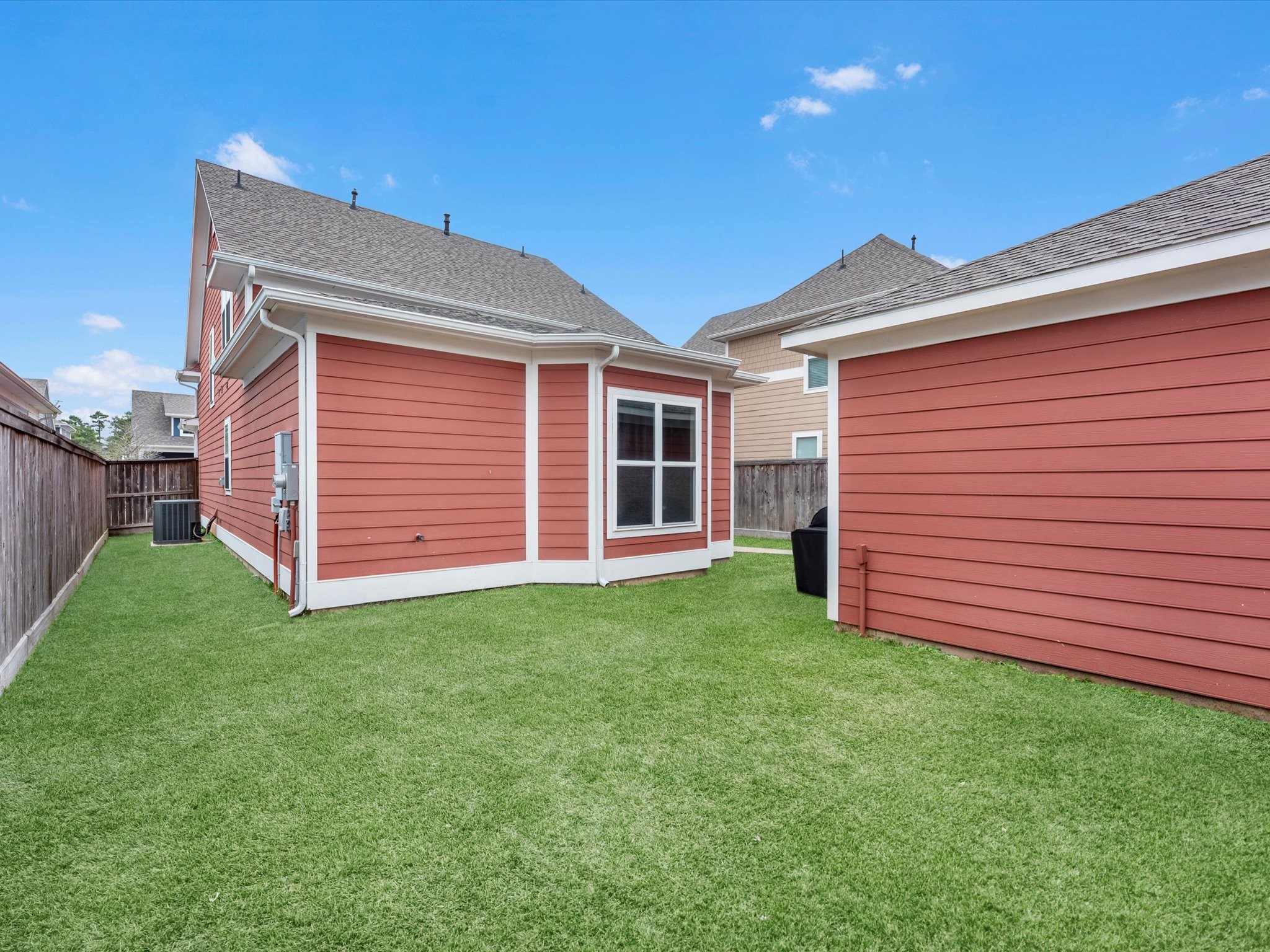 55 Red Harper Drive Spring, TX 77389 - Photo 26 of 28 a view of a backyard with wooden fence