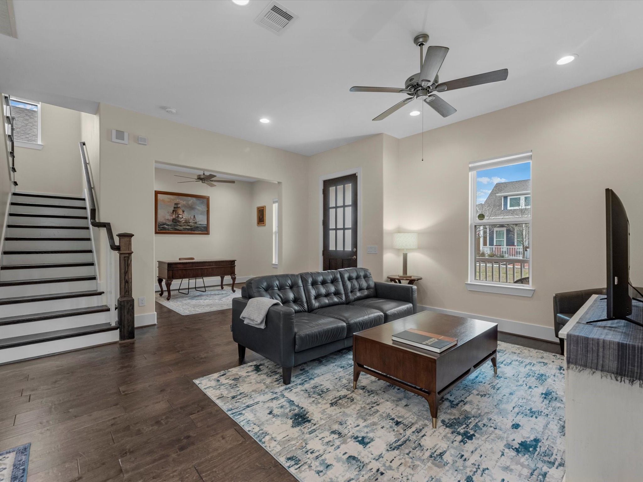 55 Red Harper Drive Spring, TX 77389 - Photo 3 of 28 a living room with furniture a rug and a flat screen tv
