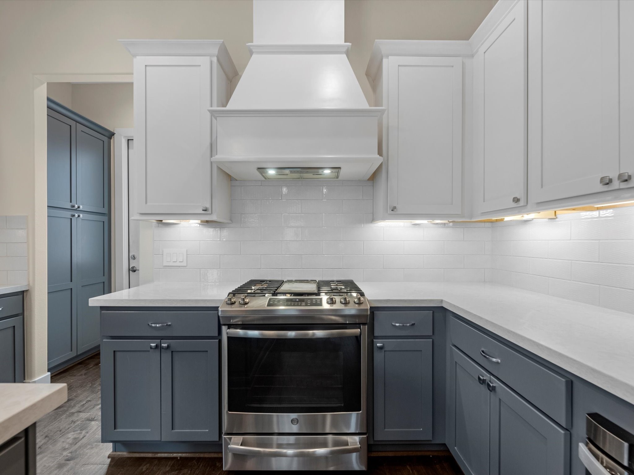 55 Red Harper Drive Spring, TX 77389 - Photo 5 of 28 a kitchen with a sink stove and cabinets