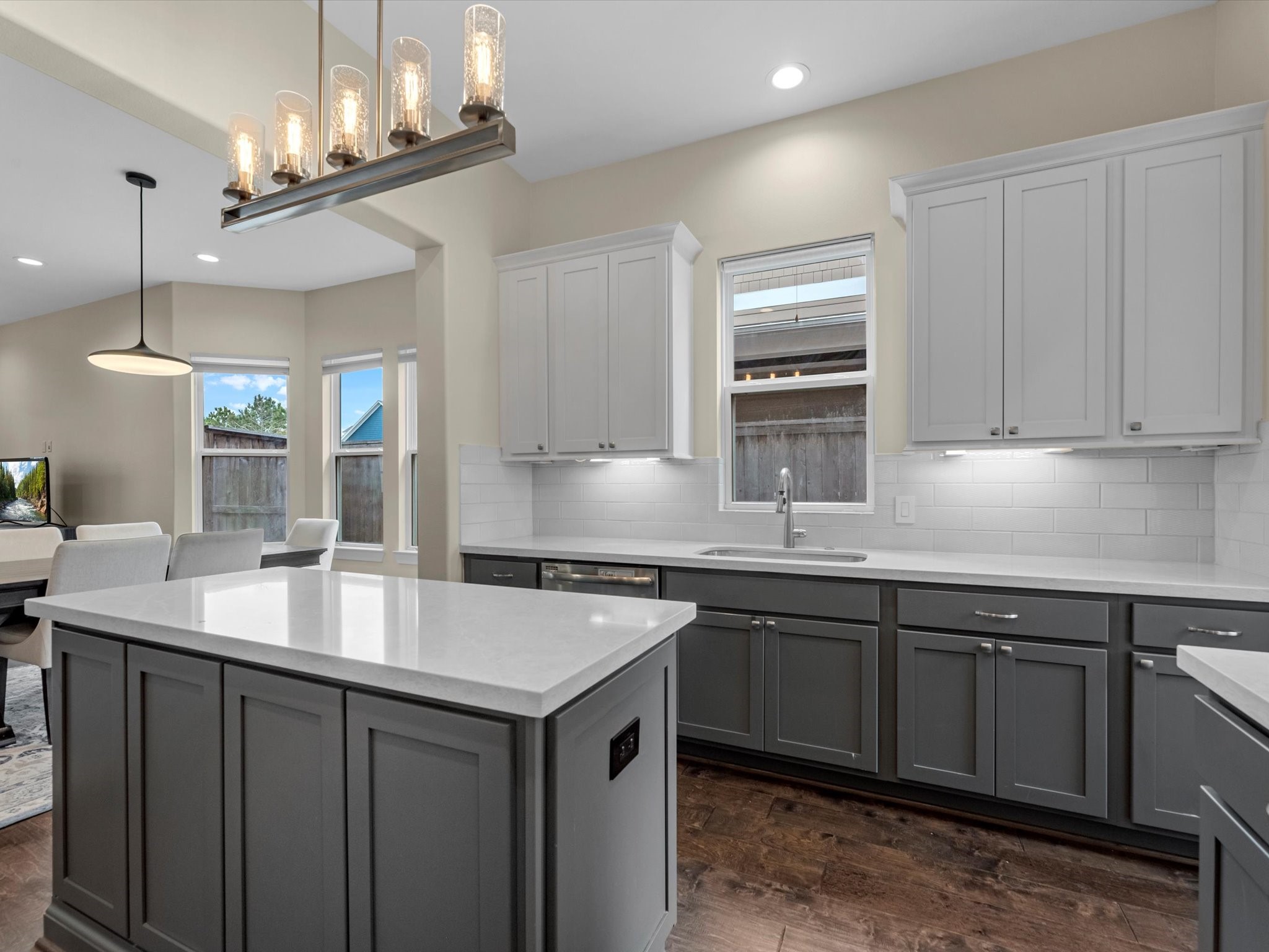 55 Red Harper Drive Spring, TX 77389 - Photo 6 of 28 a kitchen with granite countertop a sink and cabinets