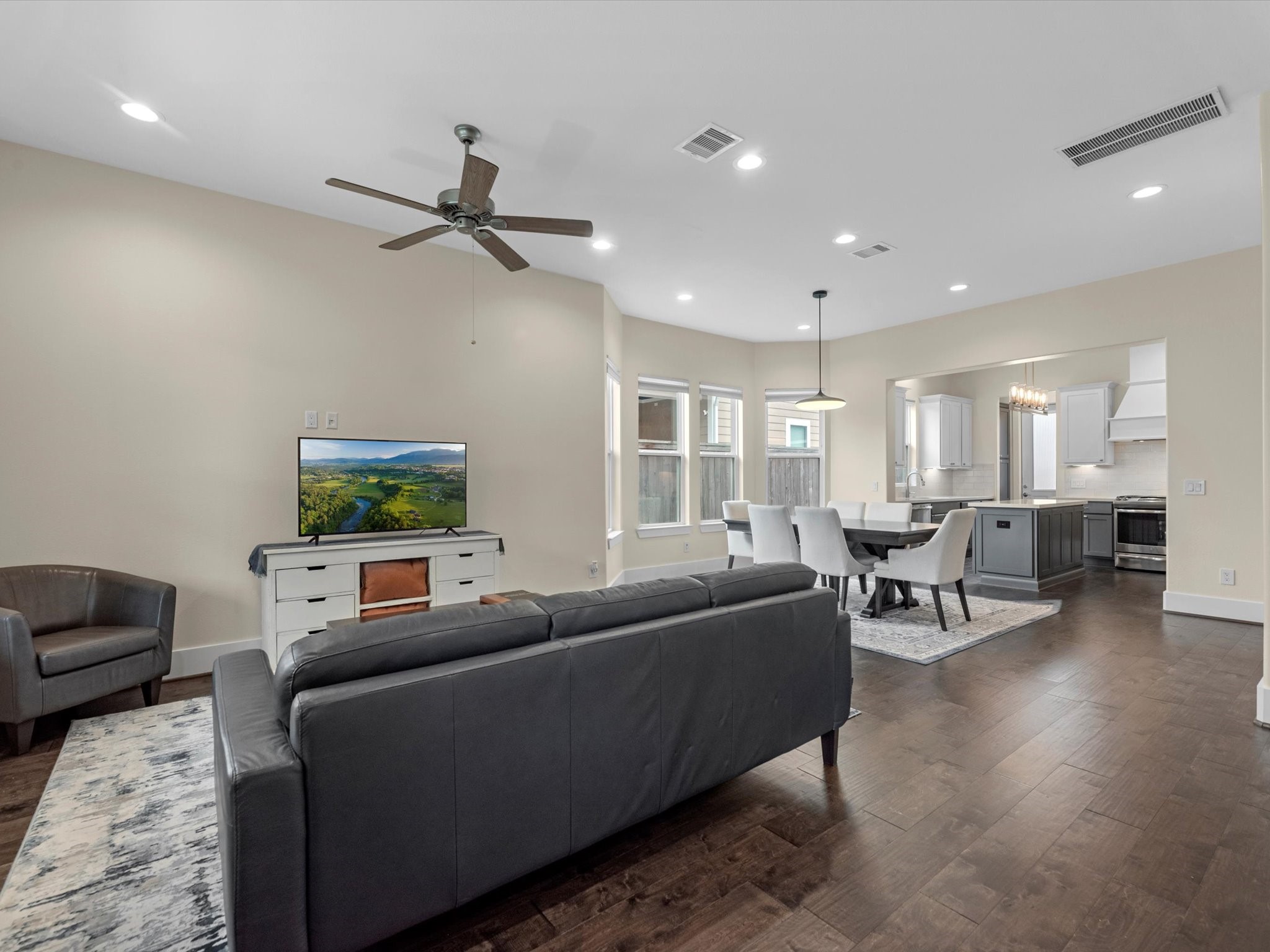 55 Red Harper Drive Spring, TX 77389 - Photo 9 of 28 a living room with furniture and a flat screen tv