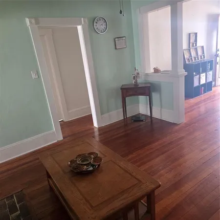 a room with furniture and wooden floor
