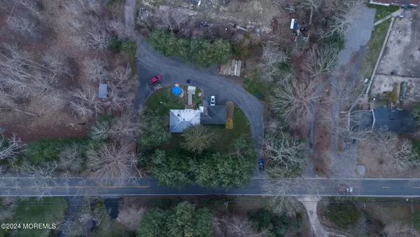 an aerial view of a house with outdoor space