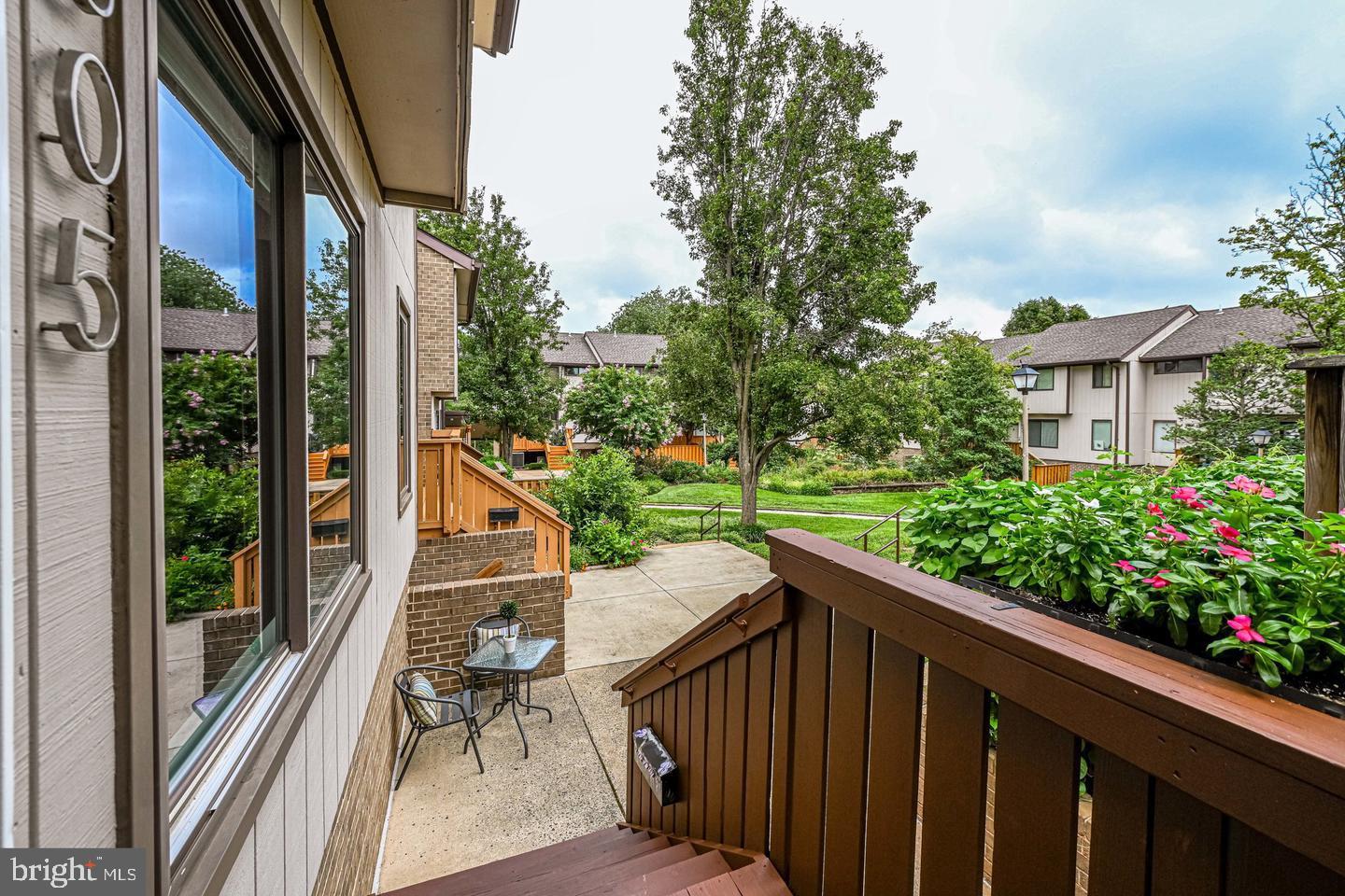 a view of a two chairs with table in balcony