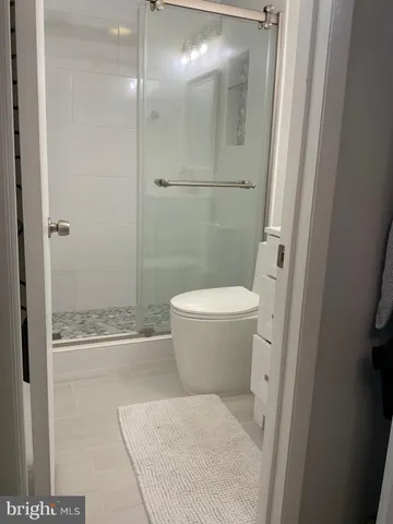 a bathroom with a toilet and shower