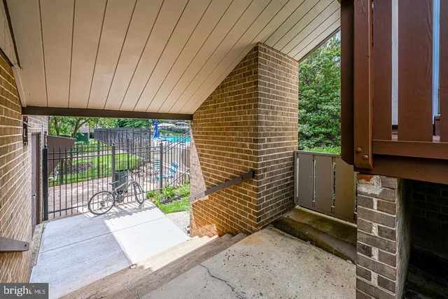 a view of a porch with wooden floor