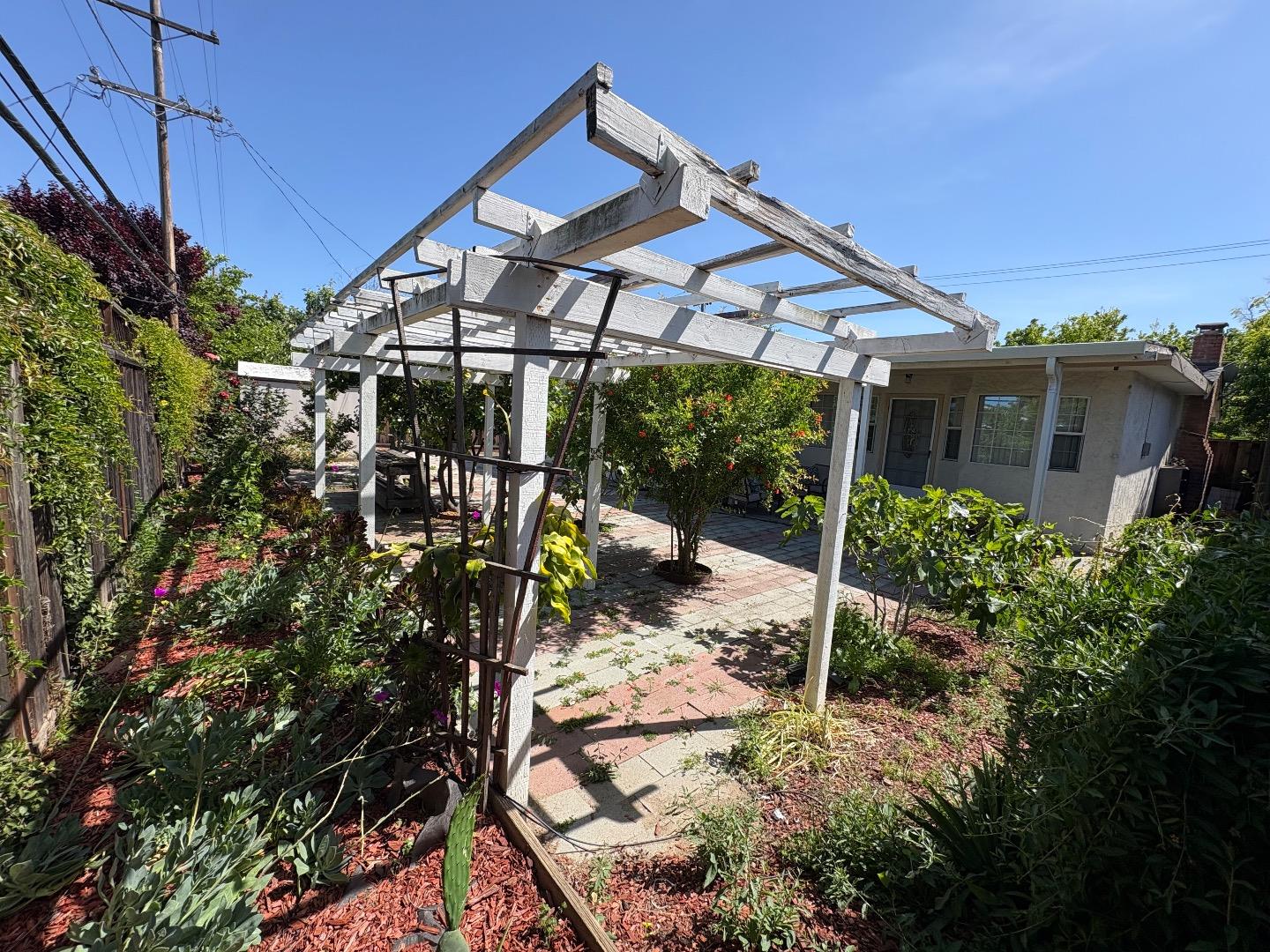 5187 Doyle Road San Jose, CA 95129 - Photo 36 of 39 a view of a house with backyard and sitting area