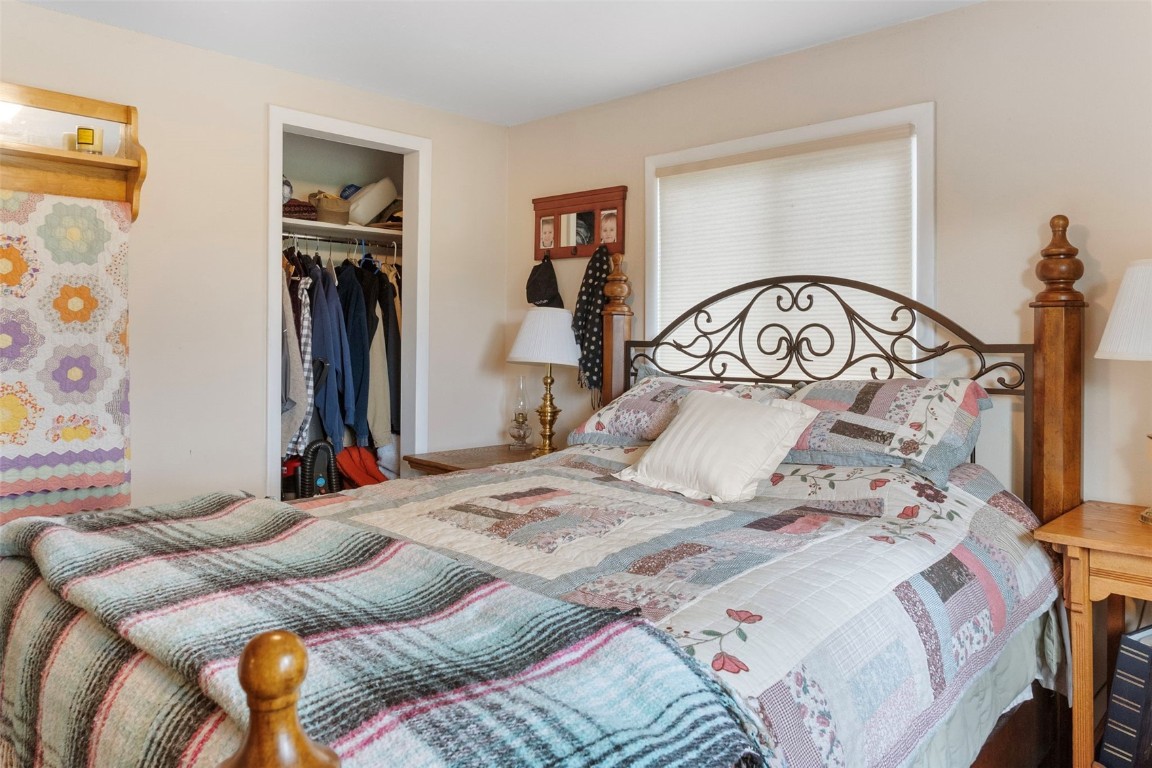 473 J Road Silverthorne, CO 80498 - Photo 14 of 38 a bedroom with a bed and a walk in closet