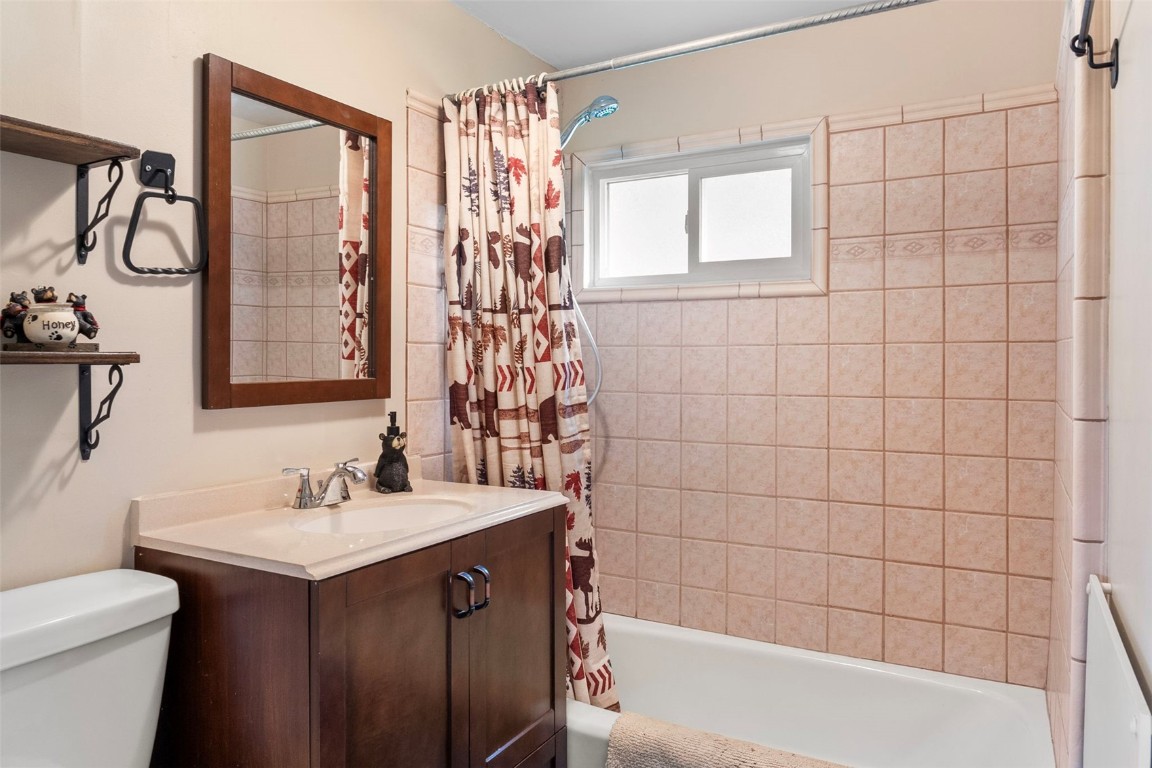 473 J Road Silverthorne, CO 80498 - Photo 15 of 38 a bathroom with a sink toilet and shower