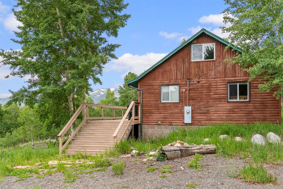 473 J Road Silverthorne, CO 80498 - Photo 31 of 38 a view of a backyard with plants and a patio