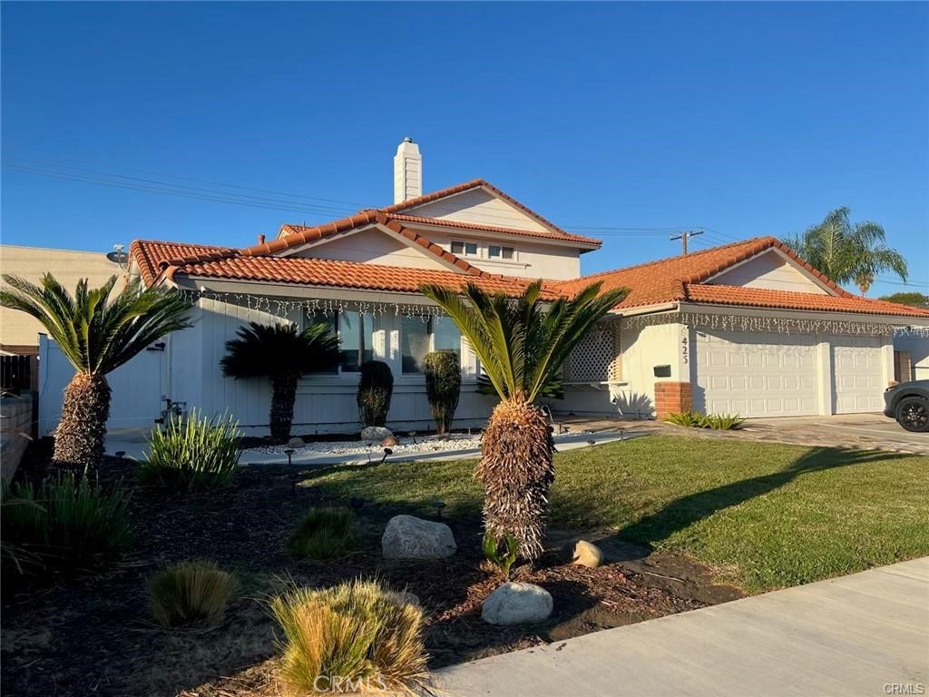 425 Lewis Place Placentia, CA 92870 - Photo 2 of 18 a front view of a house with garden
