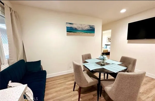 a view of a livingroom with furniture and a flat screen tv
