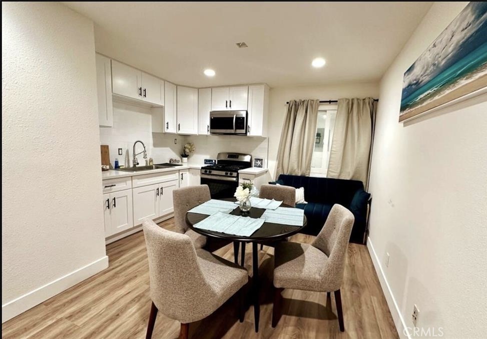 425 Lewis Place Placentia, CA 92870 - Photo 9 of 18 a view of a dining room with furniture and wooden floor