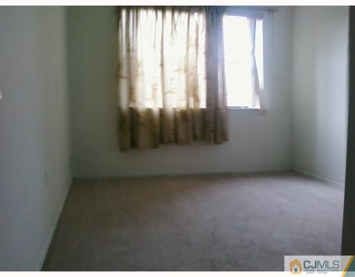 1537 Raspberry Court Edison, NJ 08817 - Photo 8 of 10 an empty room with windows