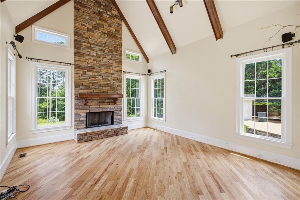 5 St Andrews Way Rome, GA 30165 - Photo 27 of 75 a view of an empty room with wooden floor fireplace and a window
