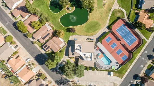 a view of a playground with big trees