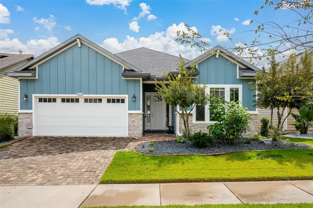 a front view of house with yard and trees