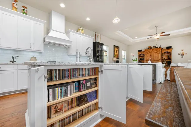 a view of an entryway and wooden floor