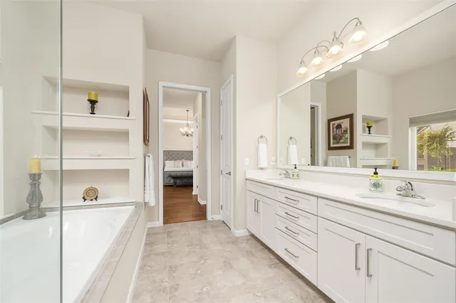 a large white kitchen with a sink