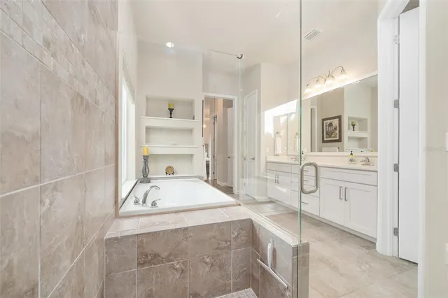 a bed room with a bed and a chair