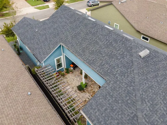 a view of residential houses with outdoor space and seating area