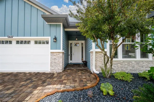 an aerial view of a house with outdoor space