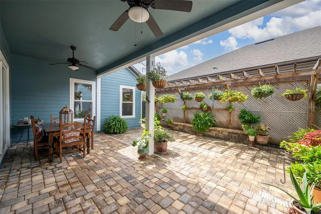 a backyard of a house with outdoor seating