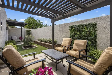 a outdoor living space with furniture and a fireplace