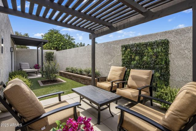 a outdoor living space with furniture and a fireplace