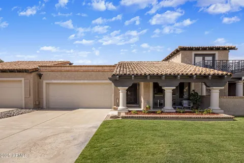 a view of a house with swimming pool and a yard