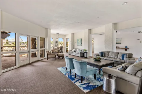 a living room with furniture and a table