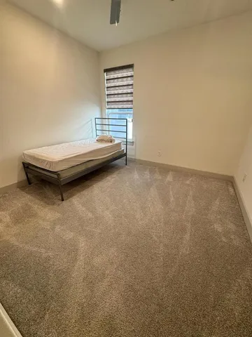 a view of a hallway view with wooden floor and staircase