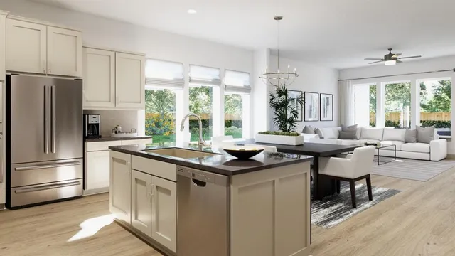 a kitchen with granite countertop a stove and a refrigerator