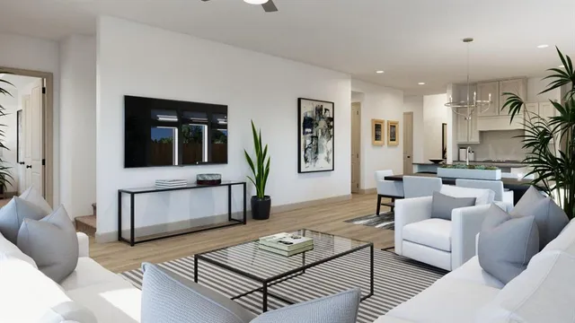 a living room with furniture and wooden floor