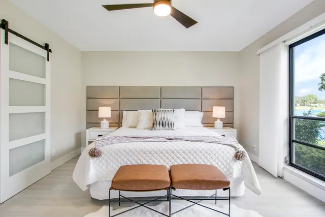 a bedroom with a bed and window