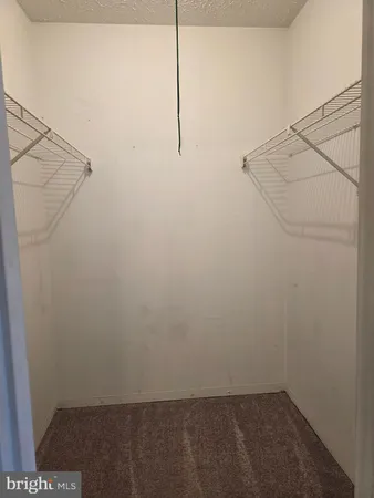 a view of a room with racks on the wall