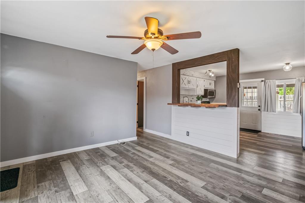 401 Rothey Drive Elizabeth, PA 15037 - Photo 3 of 17 a view of a livingroom with wooden floor and a ceiling fan