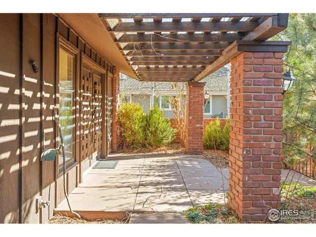 a view of a backyard with a tree