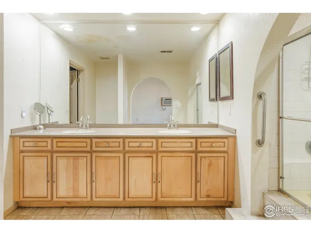 a bathroom with a sink a vanity and a mirror