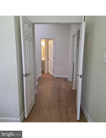 a black and white room with a large window