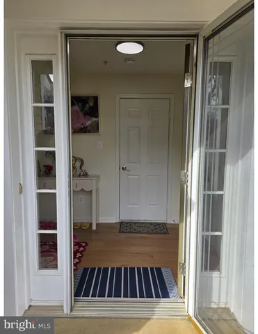 a view of a room & wooden door