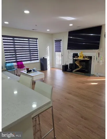 a view of a room with furniture and window