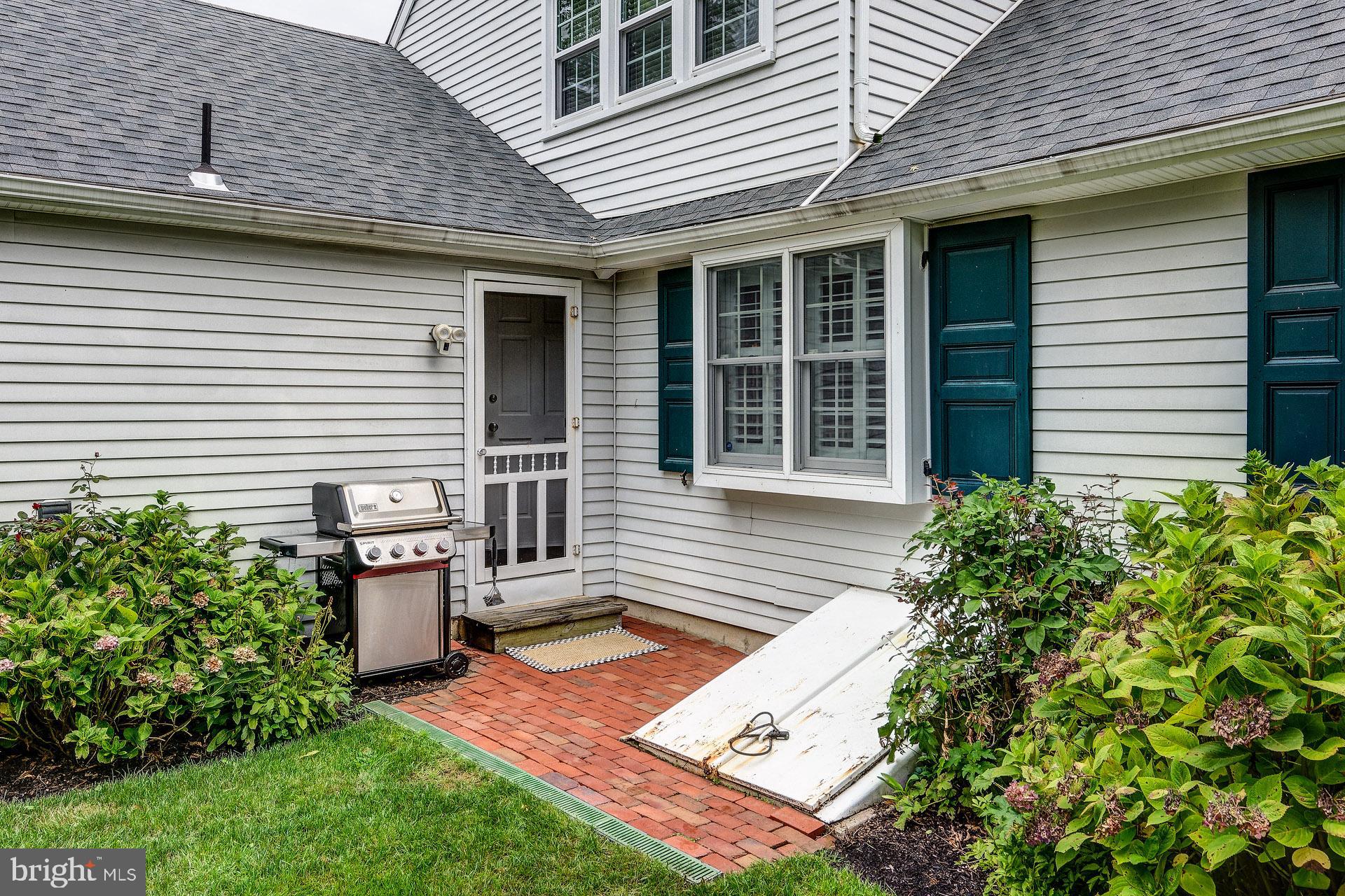 6 Heritage Road Haddonfield, NJ 08033 - Photo 18 of 61 a backyard of a house with seating space