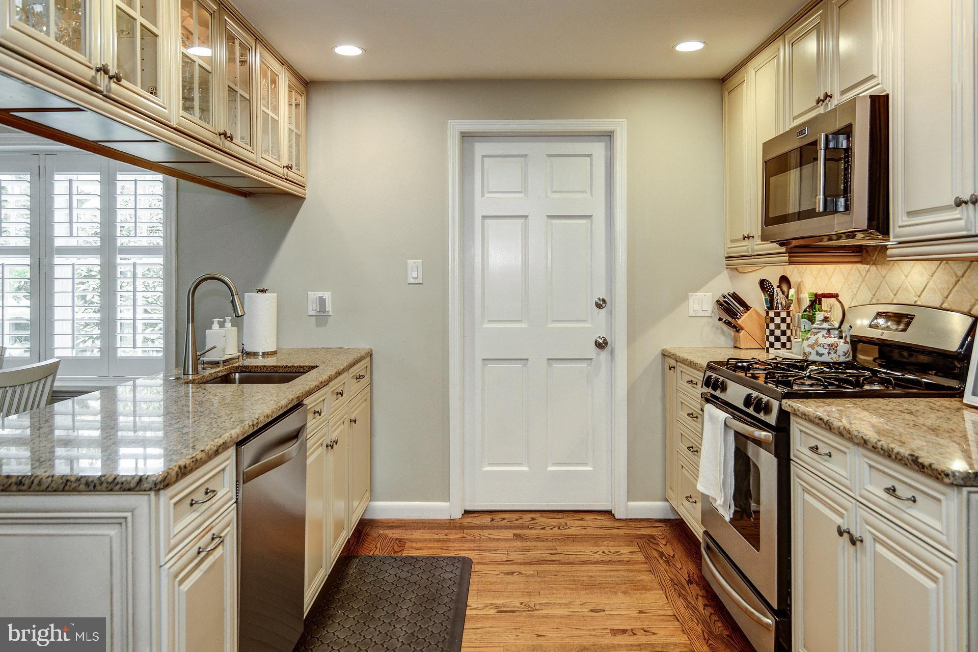 6 Heritage Road Haddonfield, NJ 08033 - Photo 26 of 61 a kitchen with stainless steel appliances granite countertop a stove a sink and a microwave