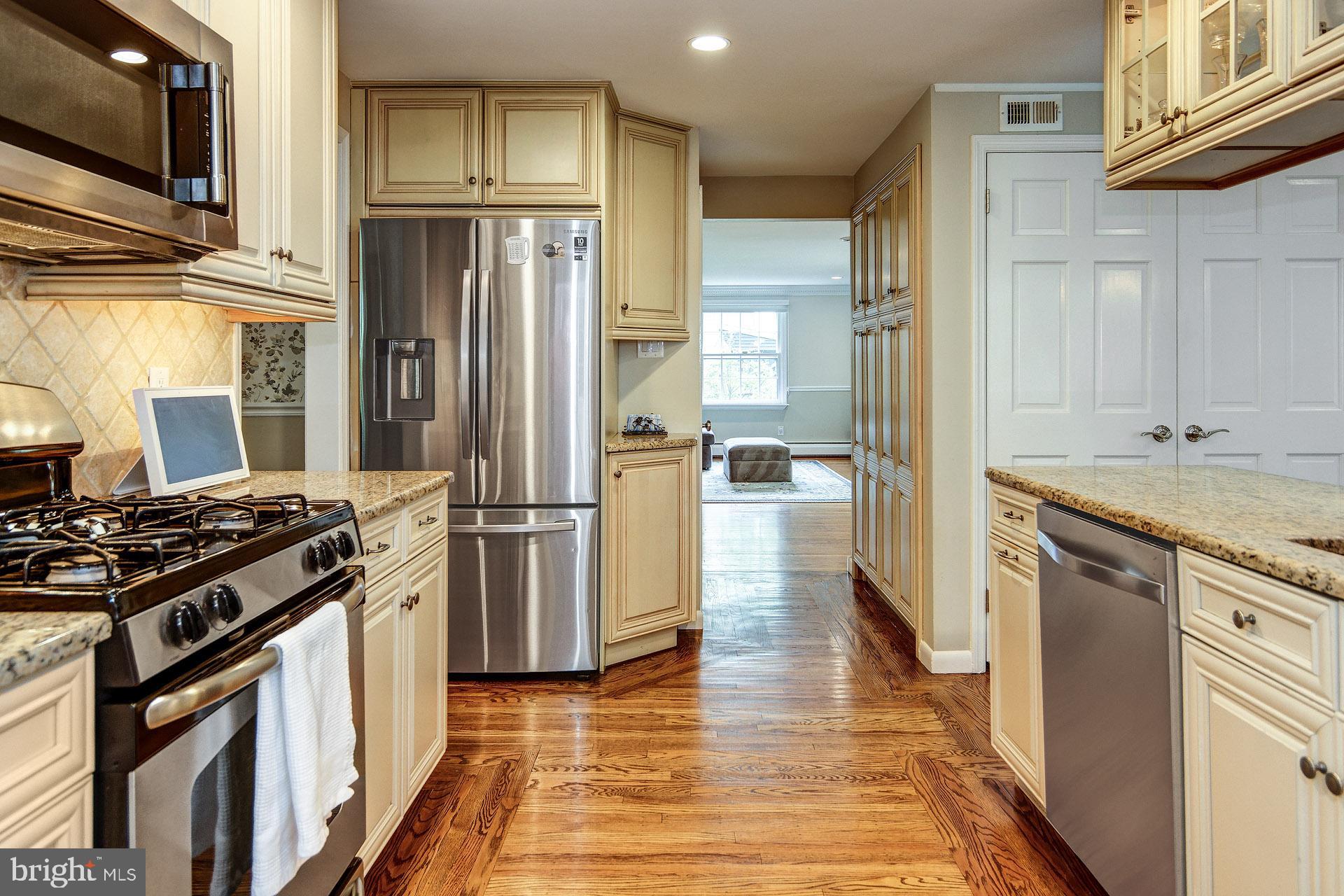 6 Heritage Road Haddonfield, NJ 08033 - Photo 27 of 61 a kitchen with stainless steel appliances granite countertop a refrigerator and a stove
