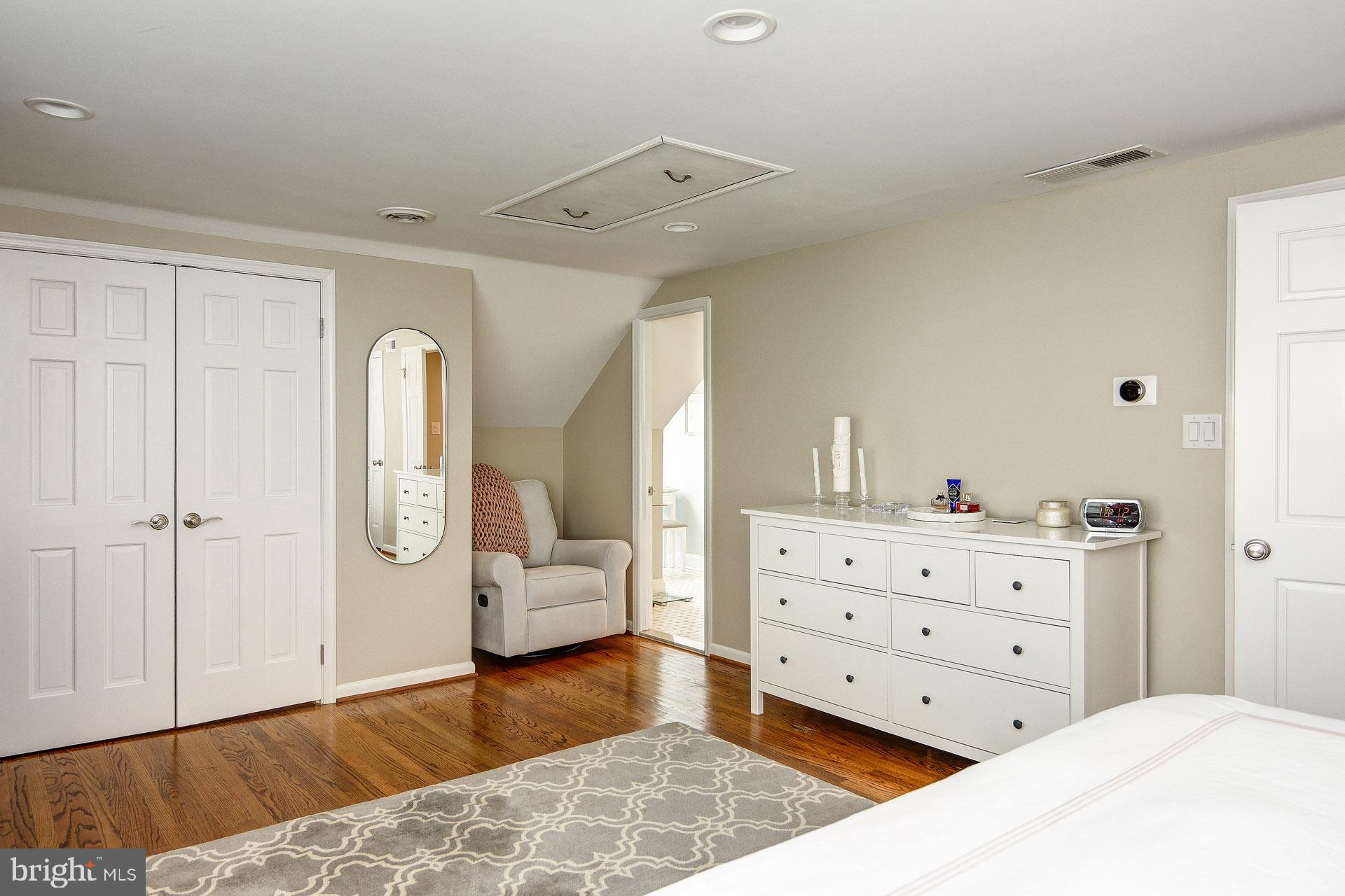 6 Heritage Road Haddonfield, NJ 08033 - Photo 50 of 61 a spacious bedroom with a bed and wooden floor
