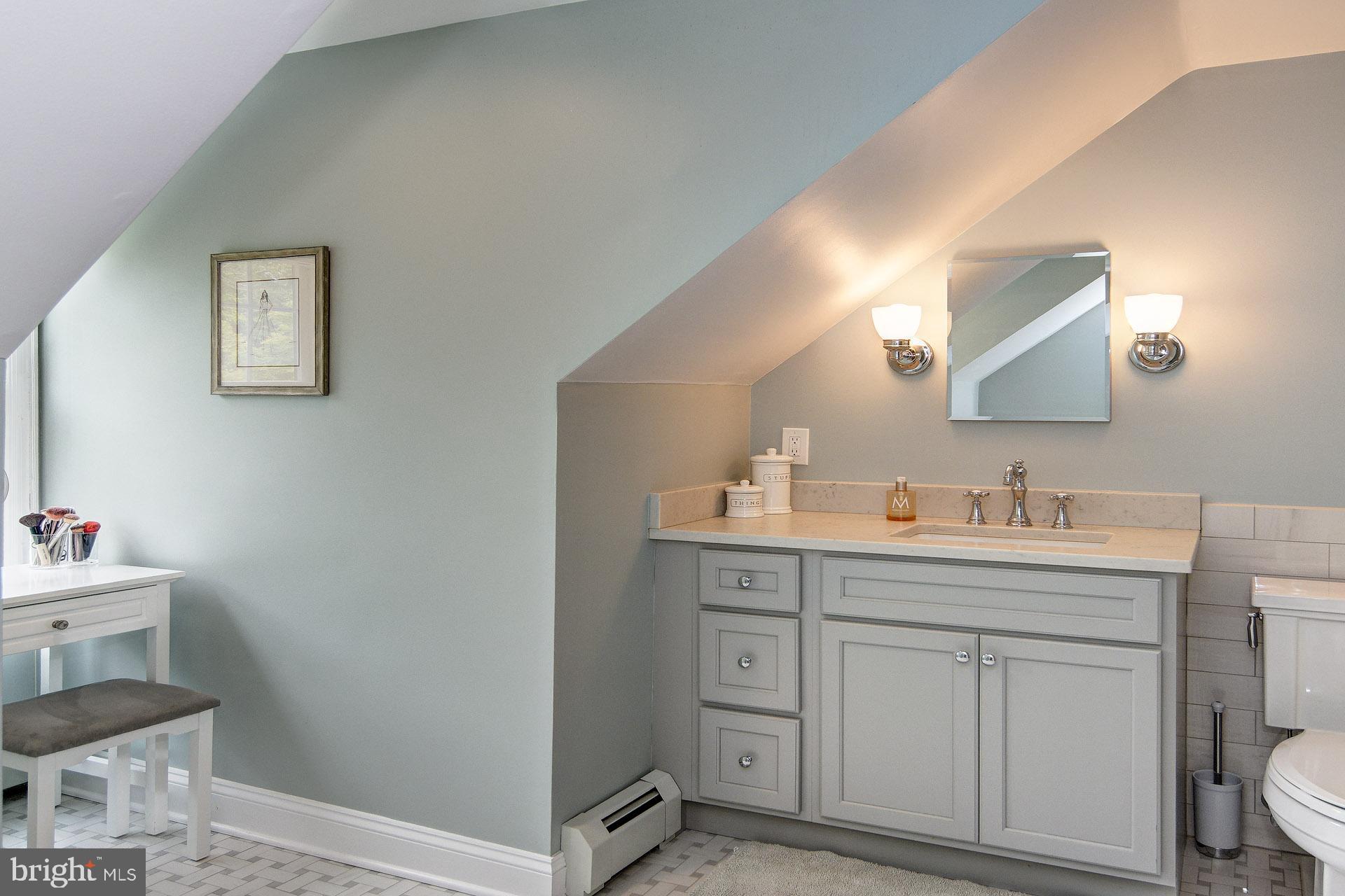 6 Heritage Road Haddonfield, NJ 08033 - Photo 52 of 61 a bathroom with a toilet sink and mirror