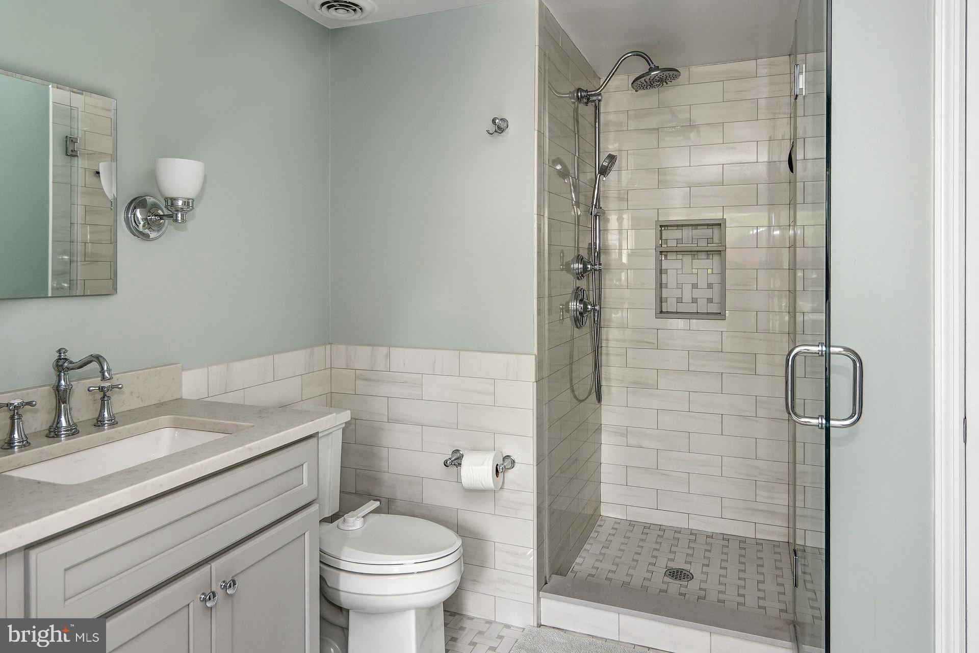 6 Heritage Road Haddonfield, NJ 08033 - Photo 53 of 61 a bathroom with a shower a sink and toilet