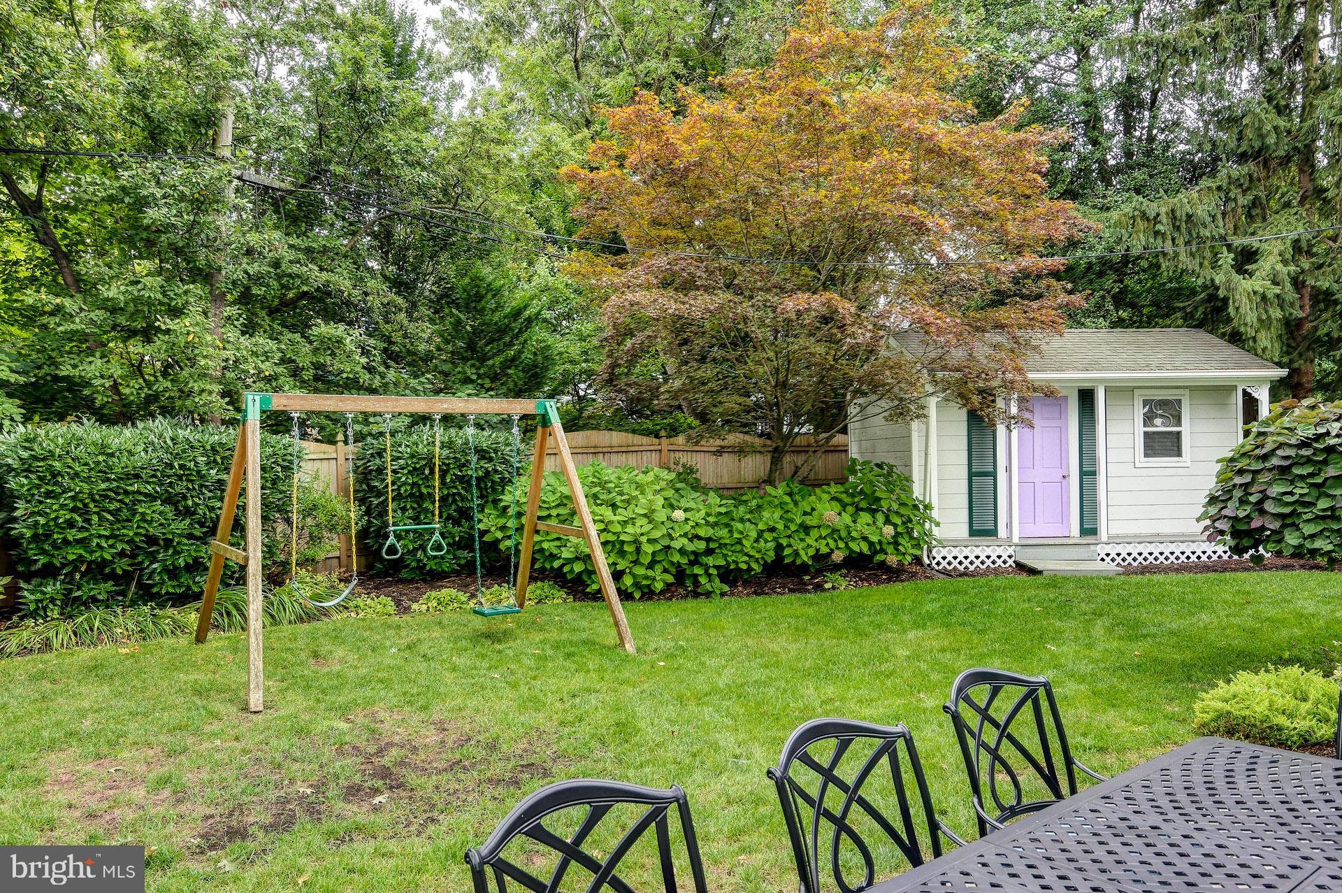 6 Heritage Road Haddonfield, NJ 08033 - Photo 8 of 61 a view of backyard with table and chairs and potted plants