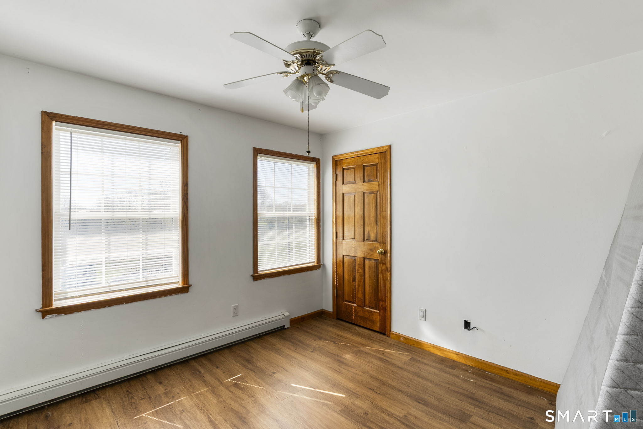 341 High Street Extension Thomaston, CT 06787 - Photo 21 of 39 an empty room with windows and chandelier fan
